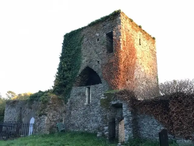 Ruined medieval stone tower and graveyard at Black Abbey near Kildare Town.